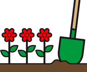 Beet mit Blumen und Schaufel